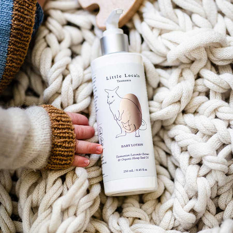 Baby Lotion Held By Baby