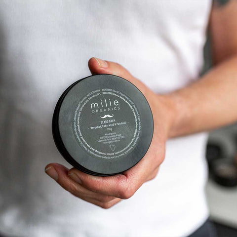Beard Balm Tin Held by shaving man